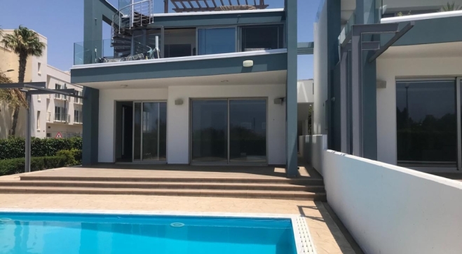 Modern ground floor apartment with pool for sale in Faros, Pervolia